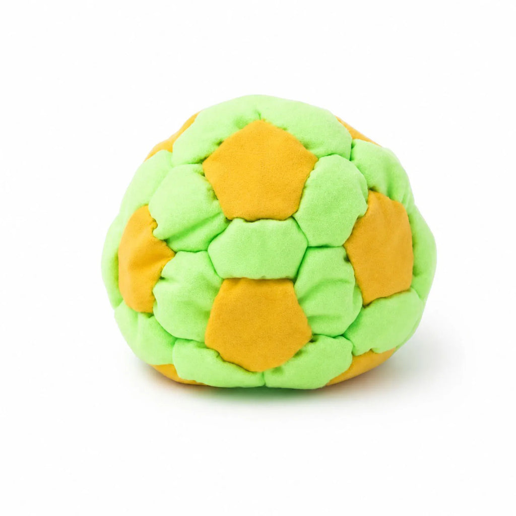 Yellow and green soft soccer footbag on a white background