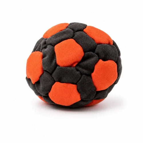 Orange and black soft soccer footbag on a white background