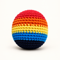 Rainbow-striped handmade crochet footbag shown as a color example; colors and patterns are selected at random.