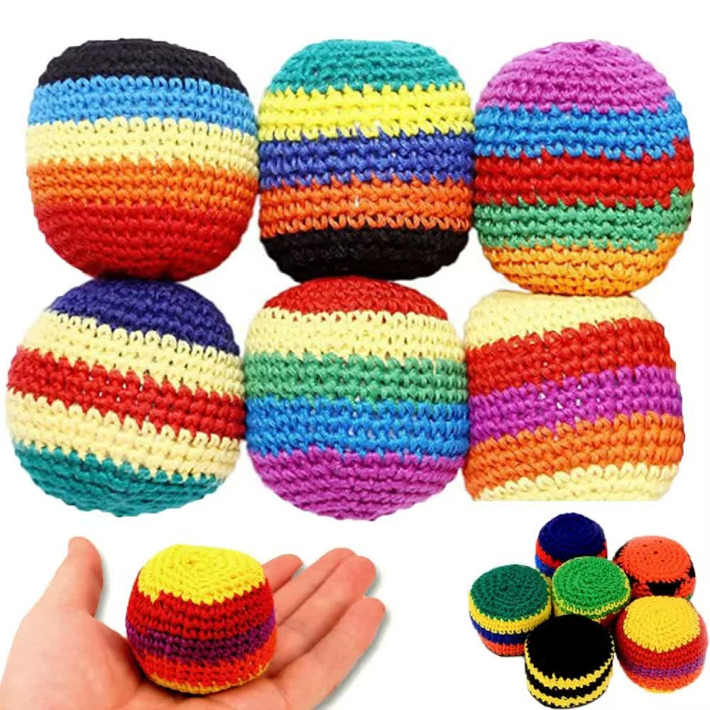 Examples of colorful handmade crochet footbag patterns, with one footbag held in a hand for scale.